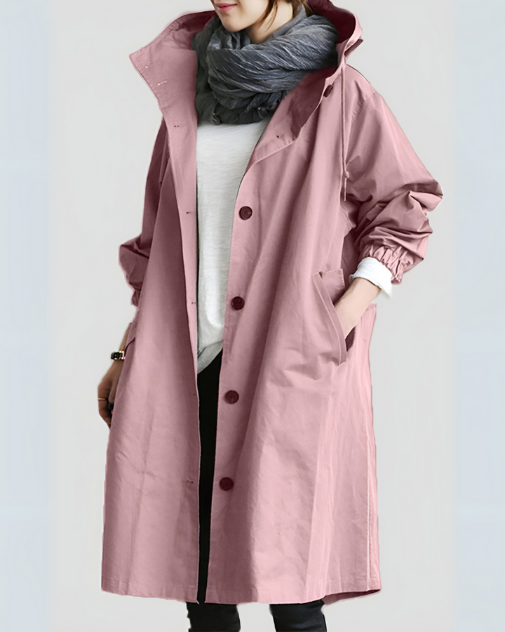 Close-up of women's classic hooded trench coat collar & hood. Elegant detail for stylish autumn outerwear.