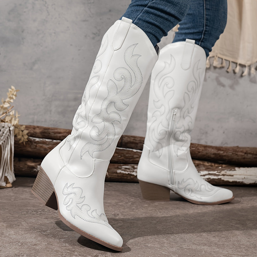 Timeless women's knee-high cowboy boots, featuring a durable block heel & elegant silhouette.