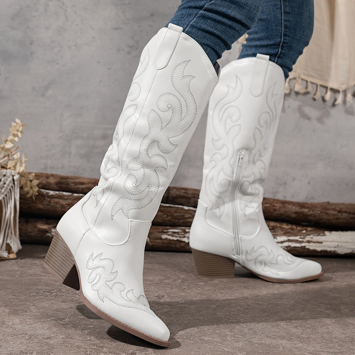 Timeless women's knee-high cowboy boots, featuring a durable block heel & elegant silhouette.
