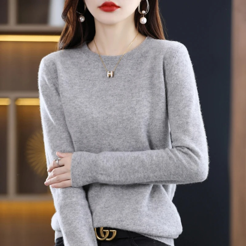 Soft, long sleeve women's round neck sweater, an essential stylish top for everyday casual wear.
