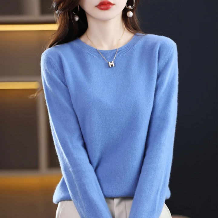 Soft knit women's long sleeve sweater with a classic round neck, comfortable everyday wear.