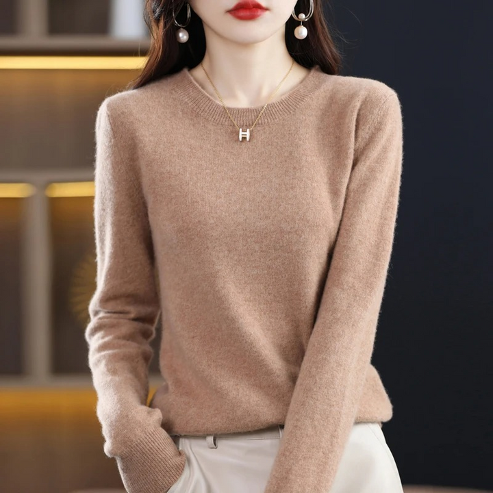 Women's classic round neck sweater, a soft and stylish long sleeve top perfect for everyday wear.