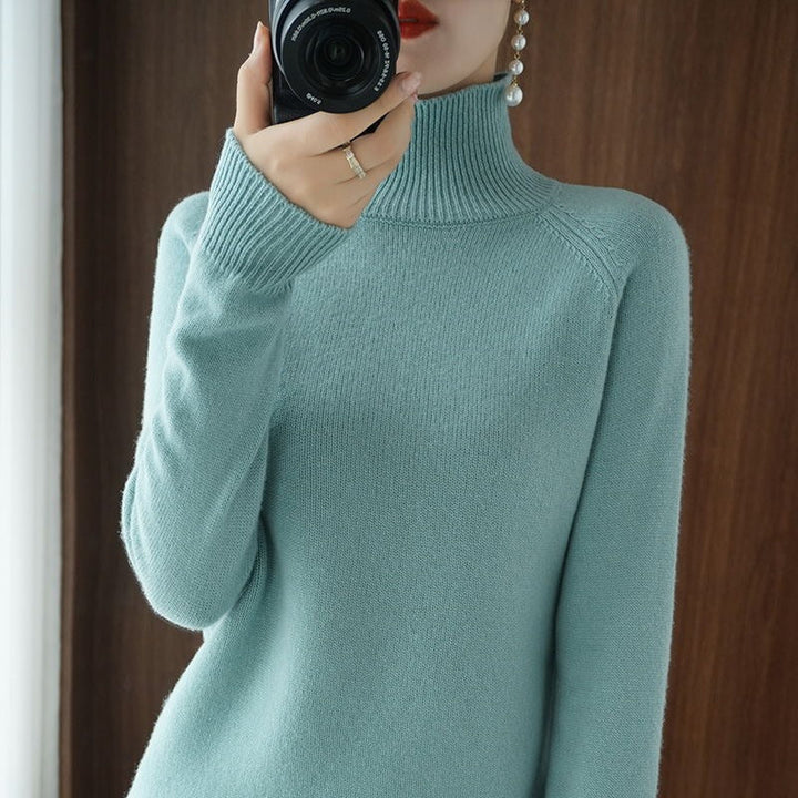 Cozy women's long sleeve turtleneck sweater for a warm and stylish fall or winter ensemble.