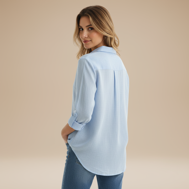 Classic long-sleeve button-up shirt for women, a timeless piece for any wardrobe.