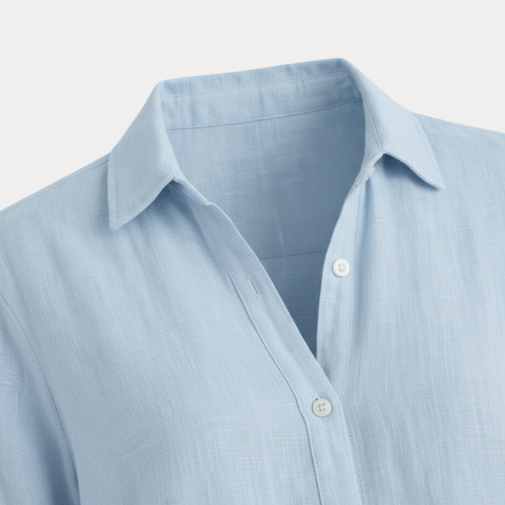 Lightweight women's button-up shirt, great for spring/summer fashion and office attire.