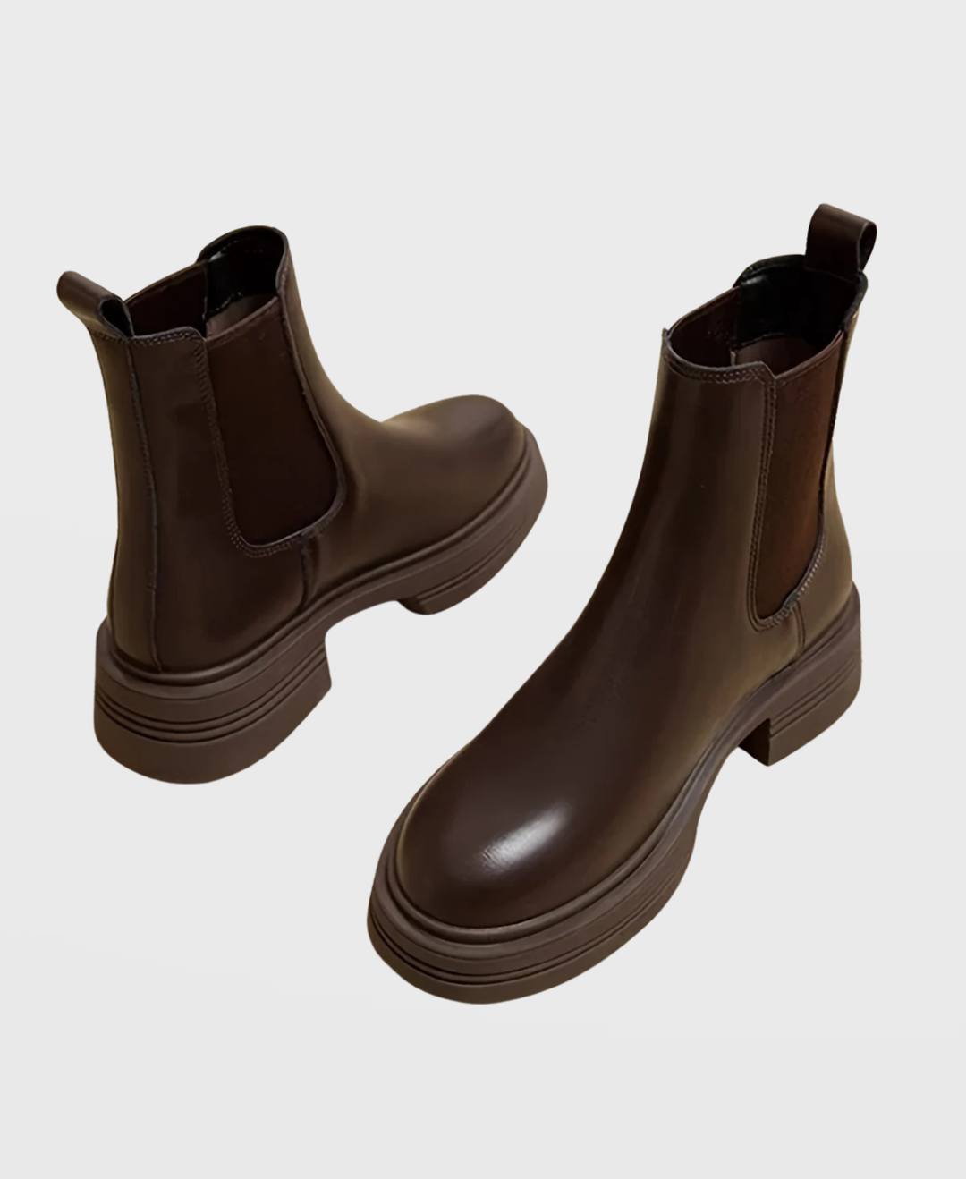 Stylish women's slip-on Chelsea ankle boots featuring a chic block heel, perfect for versatile fashion.