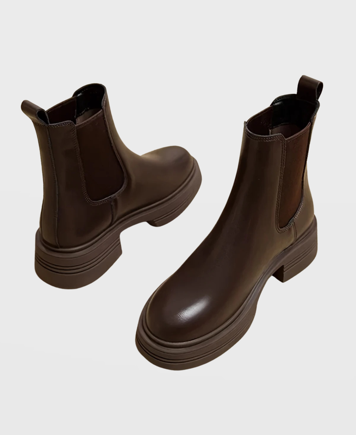 Stylish women's slip-on Chelsea ankle boots featuring a chic block heel, perfect for versatile fashion.