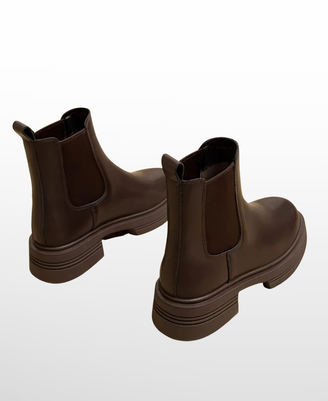 Chic women's coffee slip-on Chelsea ankle boots, featuring a block heel and round toe for modern footwear.
