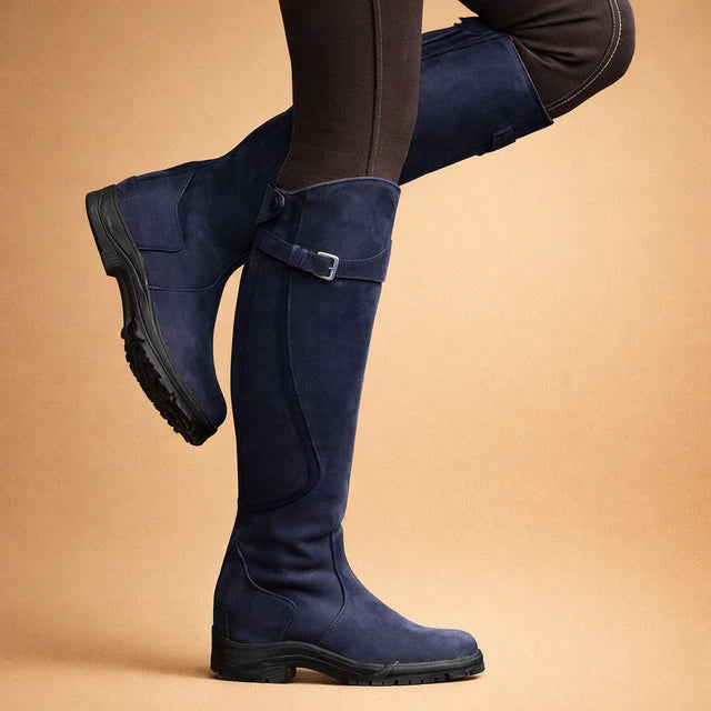 Comfortable green high boots for women, durable all-weather outdoor footwear with ankle support & traction.