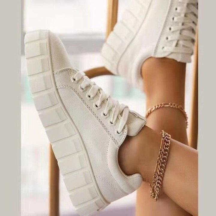 Comfortable women's low-top shoes featuring cushioned support, great for all-day wear & walking.