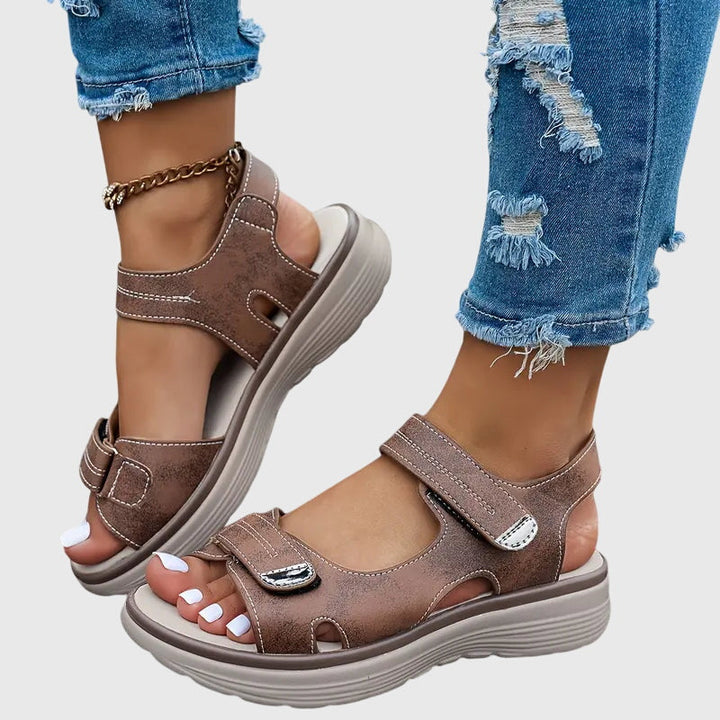 Black women's orthopaedic sandals, comfortable & supportive design, great for effective foot pain relief.