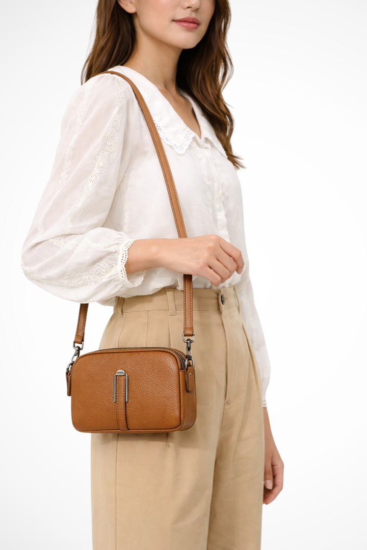 Women's compact double zip crossbody bag with textured finish, perfect everyday shoulder purse.