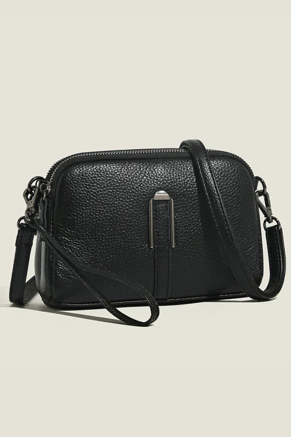 Practical women's compact shoulder bag, dual zip security, attractive textured finish, essential everyday purse.