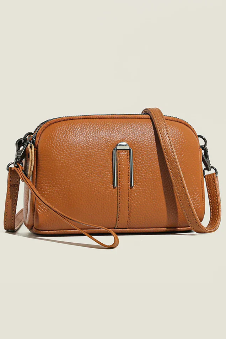 Stylish women's compact crossbody bag, dual zip closure, ideal for daily essentials & versatile wear.