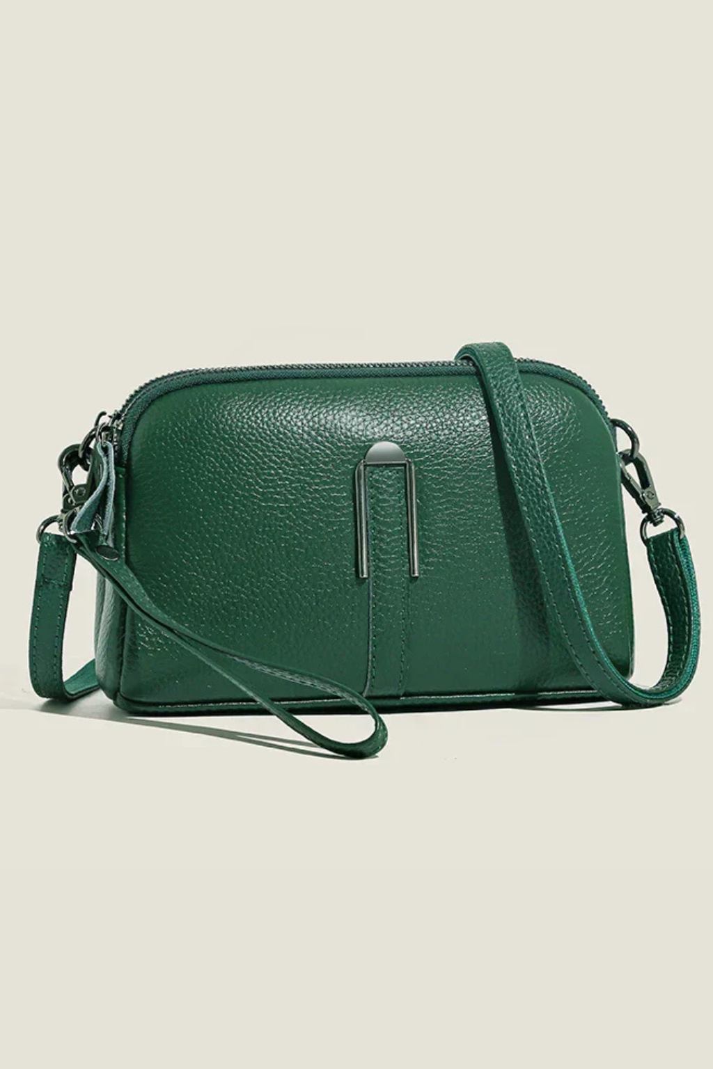 Compact women's crossbody purse featuring dual zips & textured finish for secure, stylish everyday use.