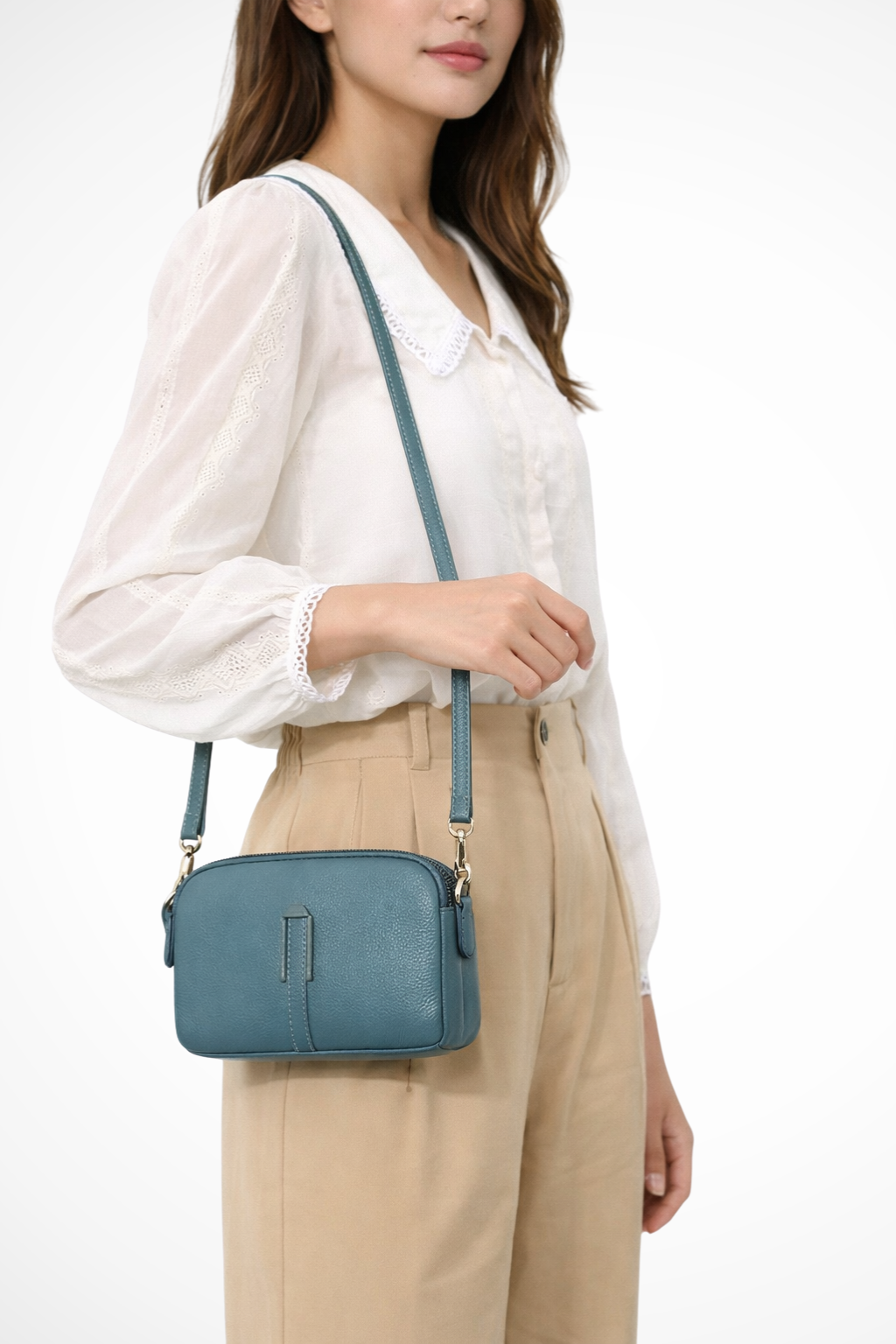 Small women's shoulder bag, compact design, double zip compartments, chic textured finish.