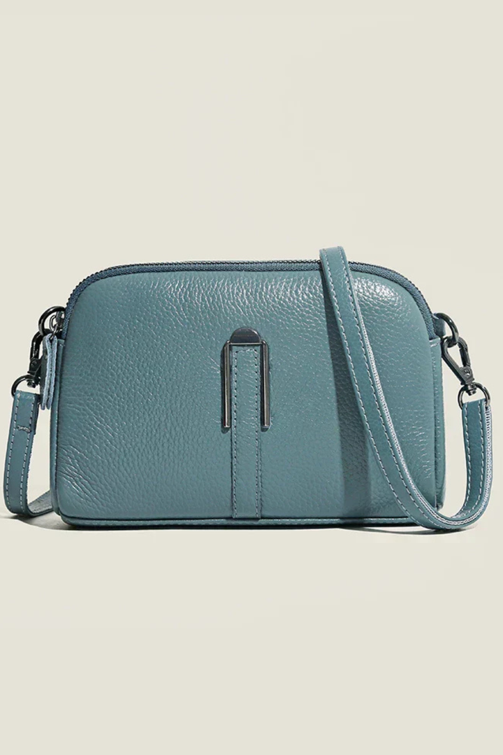 Versatile women's compact crossbody bag, sleek design with dual zip pockets, great for any occasion.