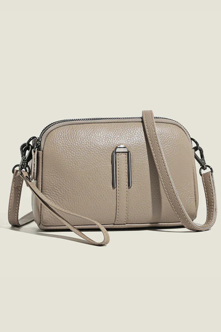 Everyday women's compact purse, stylish textured finish, practical double zip crossbody shoulder bag.