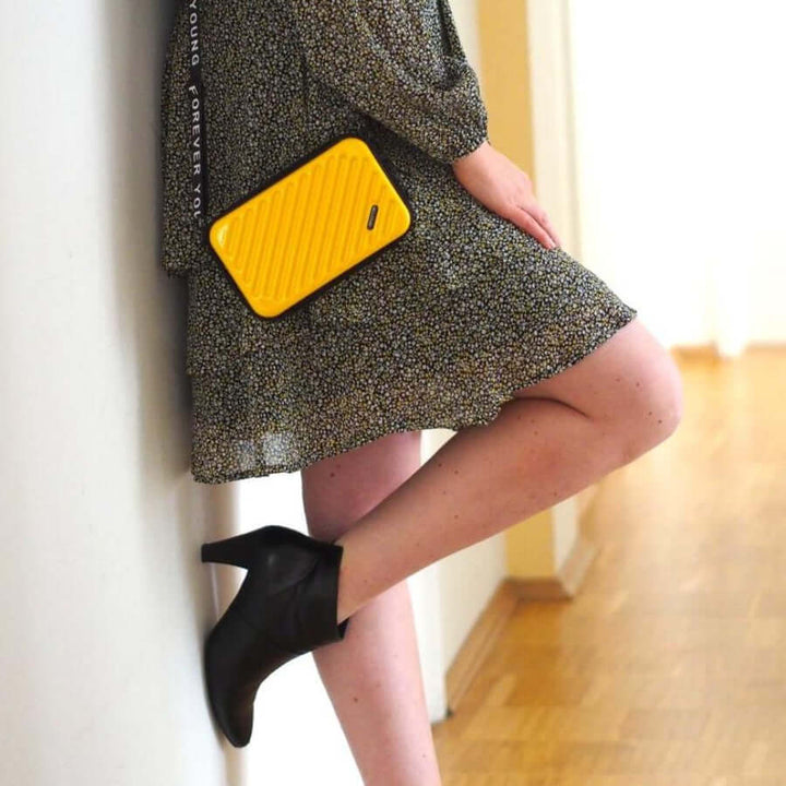 Hands-free women's compact hard shell crossbody travel handbag, perfect for on-the-go.