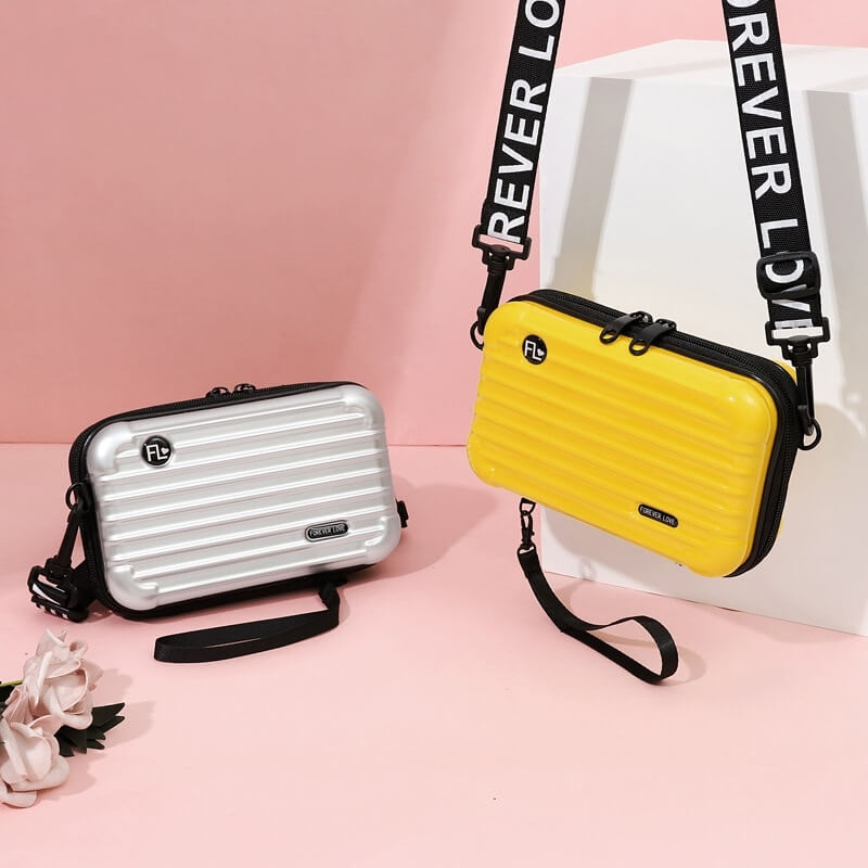 Small waterproof hard shell travel bag, perfect for women's essentials, secure & compact.