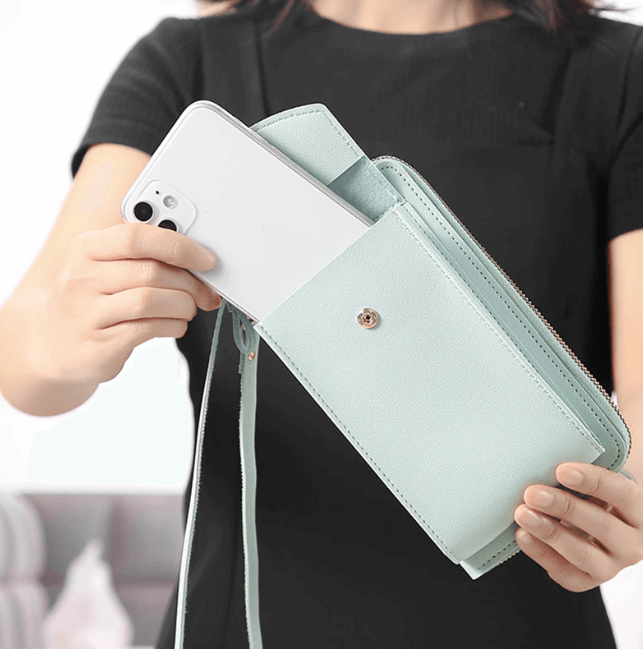 Side view of women's lightweight PU leather shoulder bag, showing adjustable strap.