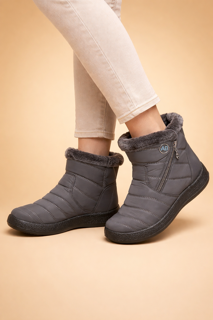 Women's warm winter ankle boots designed for cold weather, providing cozy lined comfort & style.
