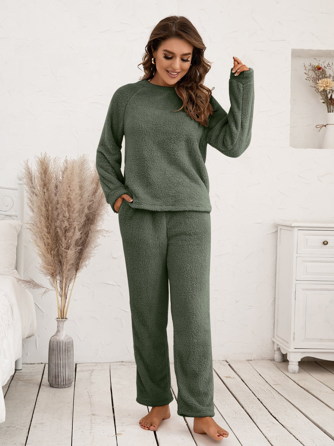 Chic women's sleep set, featuring a long sleeve top and loose-fit comfortable pajama pants.