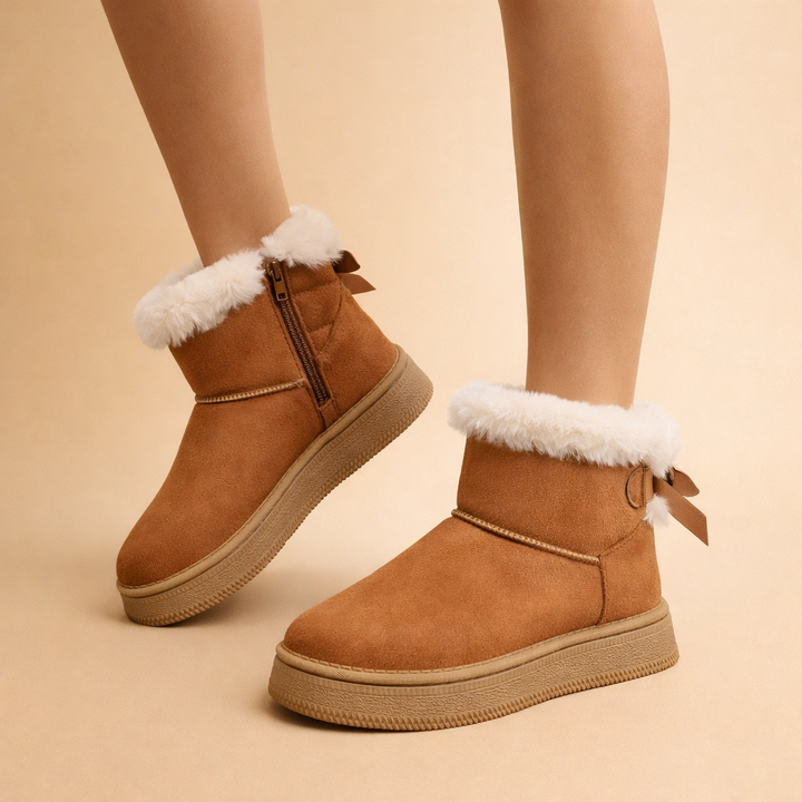 Comfortable women's slip-on winter boots. Warm, cozy ankle footwear for casual everyday wear in cold weather.