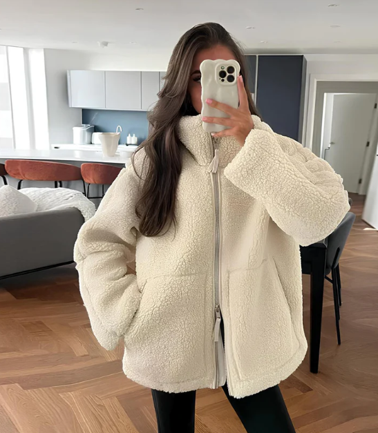 Women's cozy zip-up winter jacket, perfect for warmth & style in fall/winter casual wear.