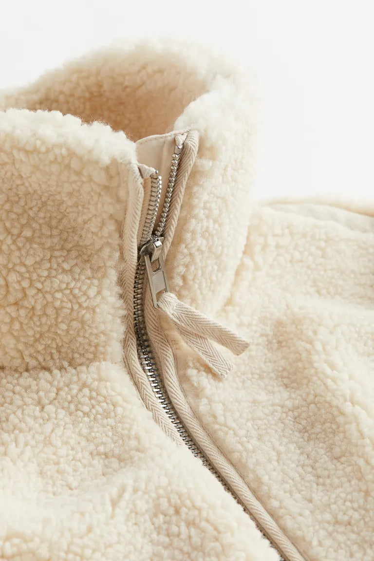 Warm women's zip-up winter jacket. Soft, cozy outerwear for stylish fall and everyday casual wear.