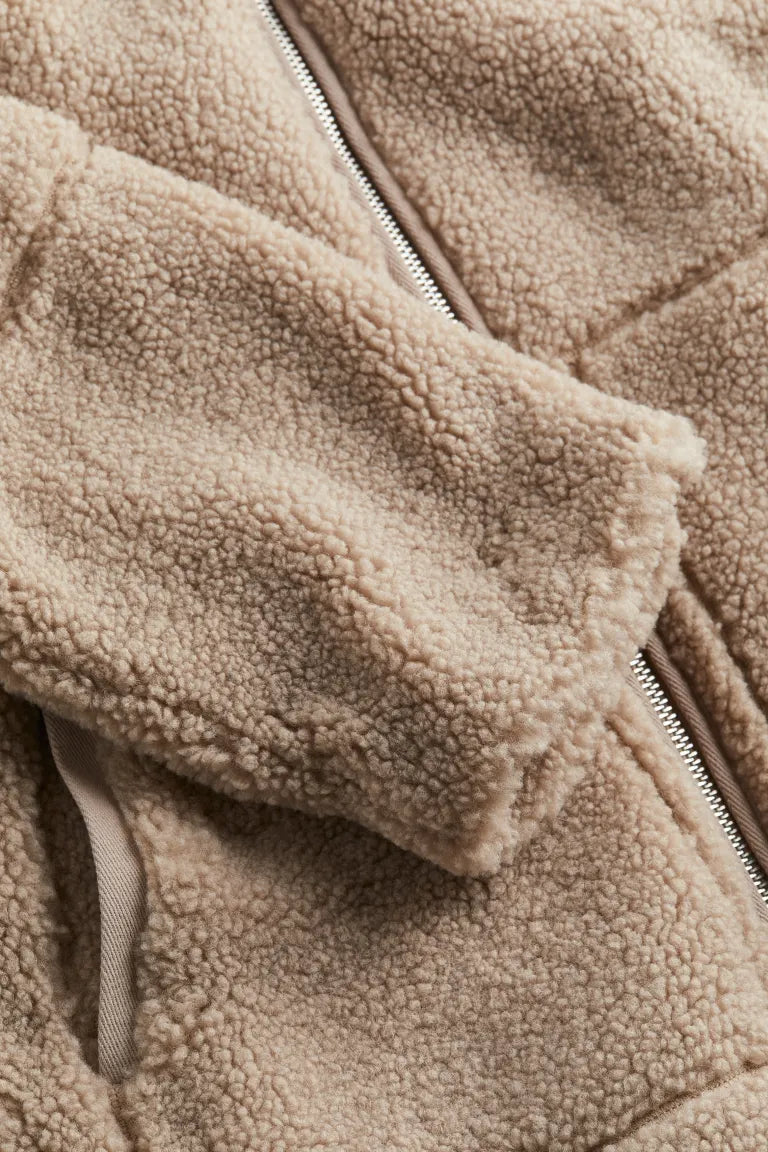 Comfortable women's cozy zip-up winter jacket, ideal for warmth & casual wear during cold fall/winter days.