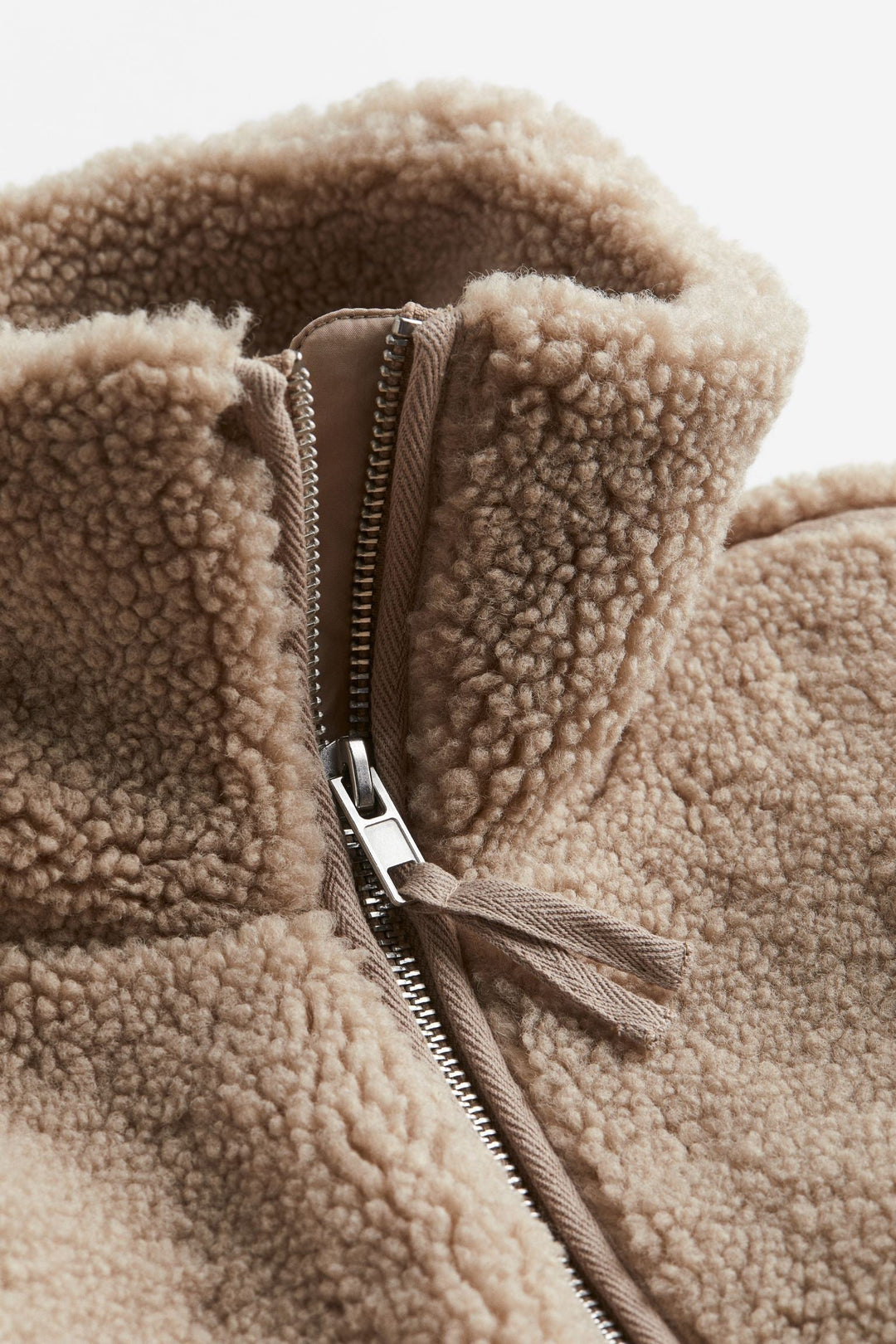 Chic women's warm winter jacket with zip-up design, essential for cozy fall & winter fashion outerwear.