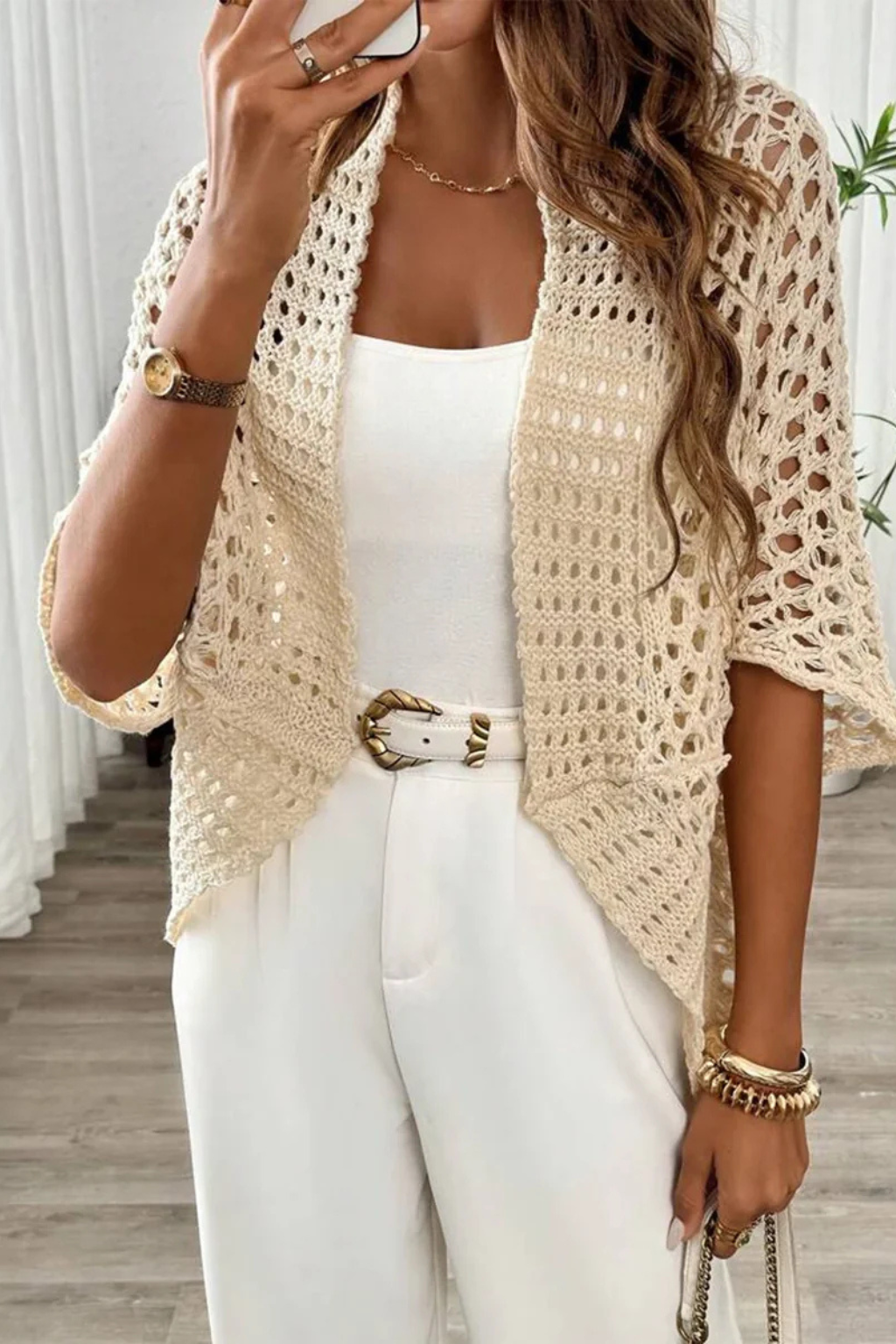 Breathable women's short sleeve crochet cardigan, open front, comfortable for warm weather.