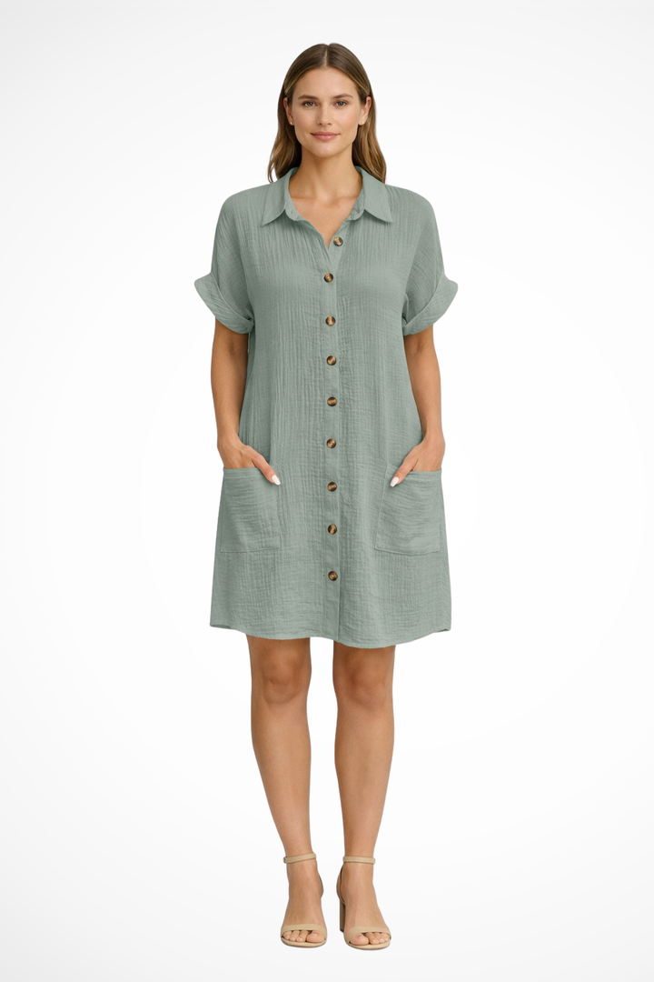 Flowy women's short sleeve beach dress with button front, ideal for relaxed resort wear or a casual summer day.