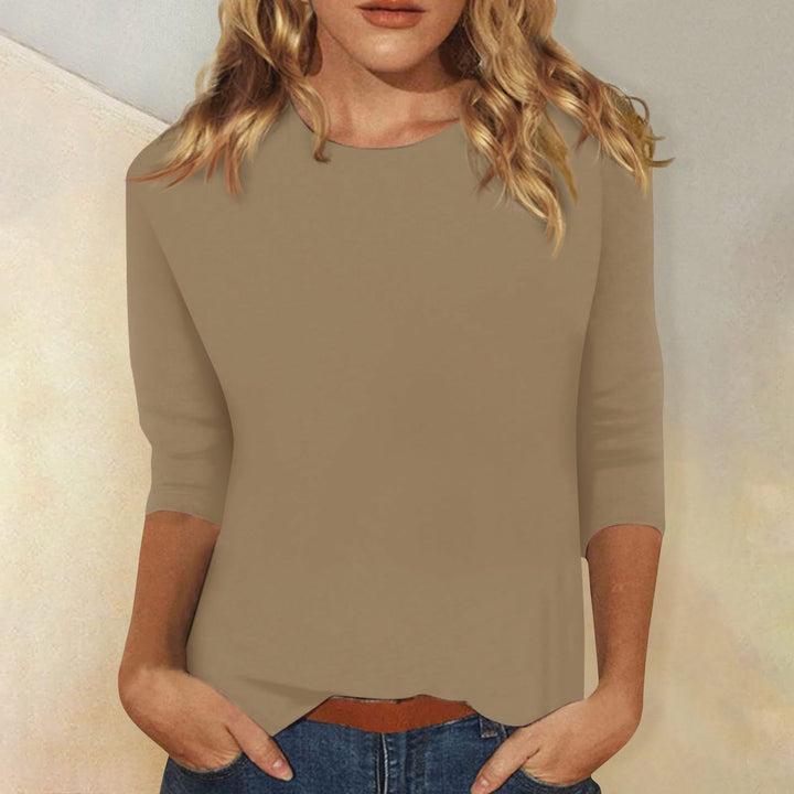 Comfortable women's basic tee with three-quarter sleeves, round neck, perfect for versatile everyday wear.