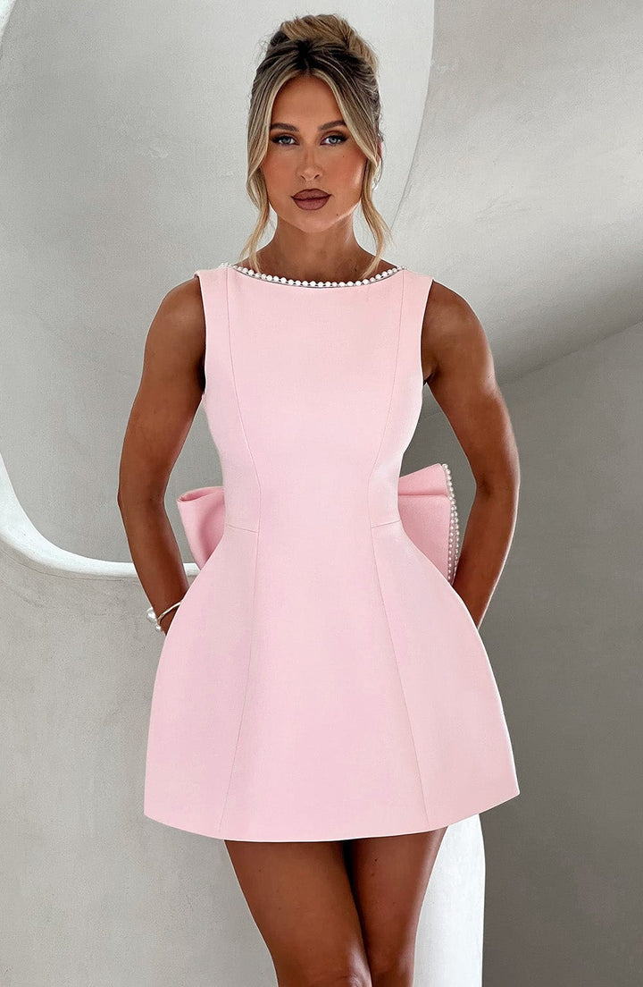 Women's elegant A-line mini dress with pearl trim, perfect for wedding guests and formal parties.
