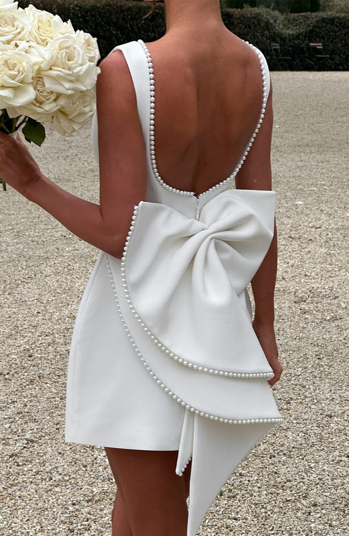 Versatile women's A-line mini dress with pearl detail. Suitable for summer weddings, parties & formal events.