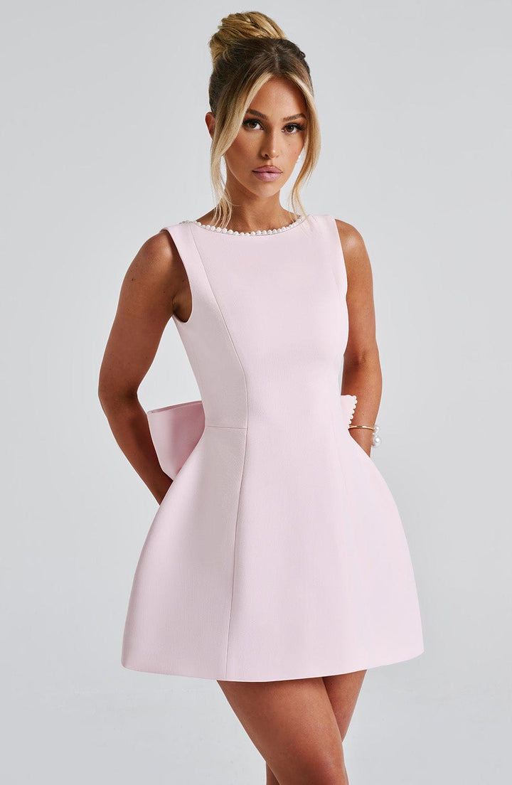 Chic A-line mini dress for women, delicate pearl trim. Ideal summer wedding guest dress & cocktail wear.