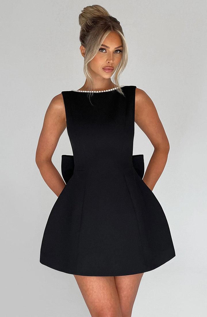 Formal A-line mini dress with pearl embellishments. Sophisticated women's wedding guest & party attire.