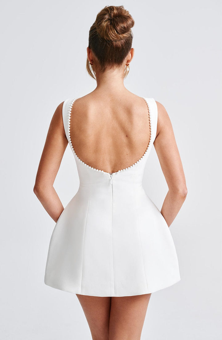 Sophisticated women's pearl trim A-line mini dress. Perfect for cocktail parties, weddings & formal events.