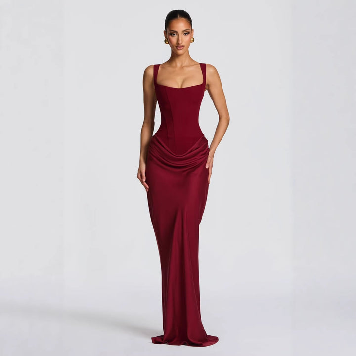 Black fitted maxi dress with elegant deep V-neckline, thin spaghetti straps. Women's long formal party dress.