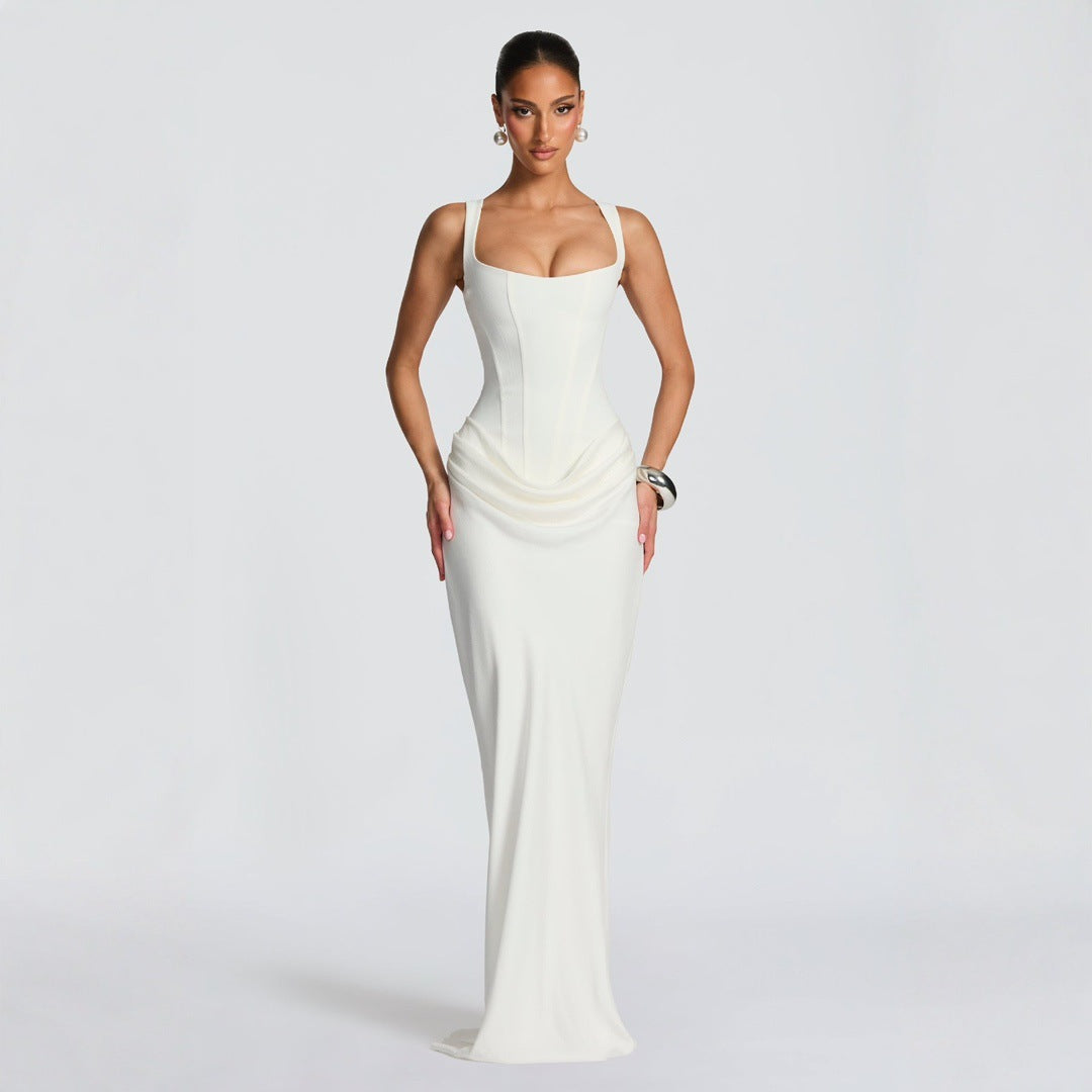 Elegant women's black fitted maxi dress, deep neckline, spaghetti straps. Ideal formal or evening party attire.