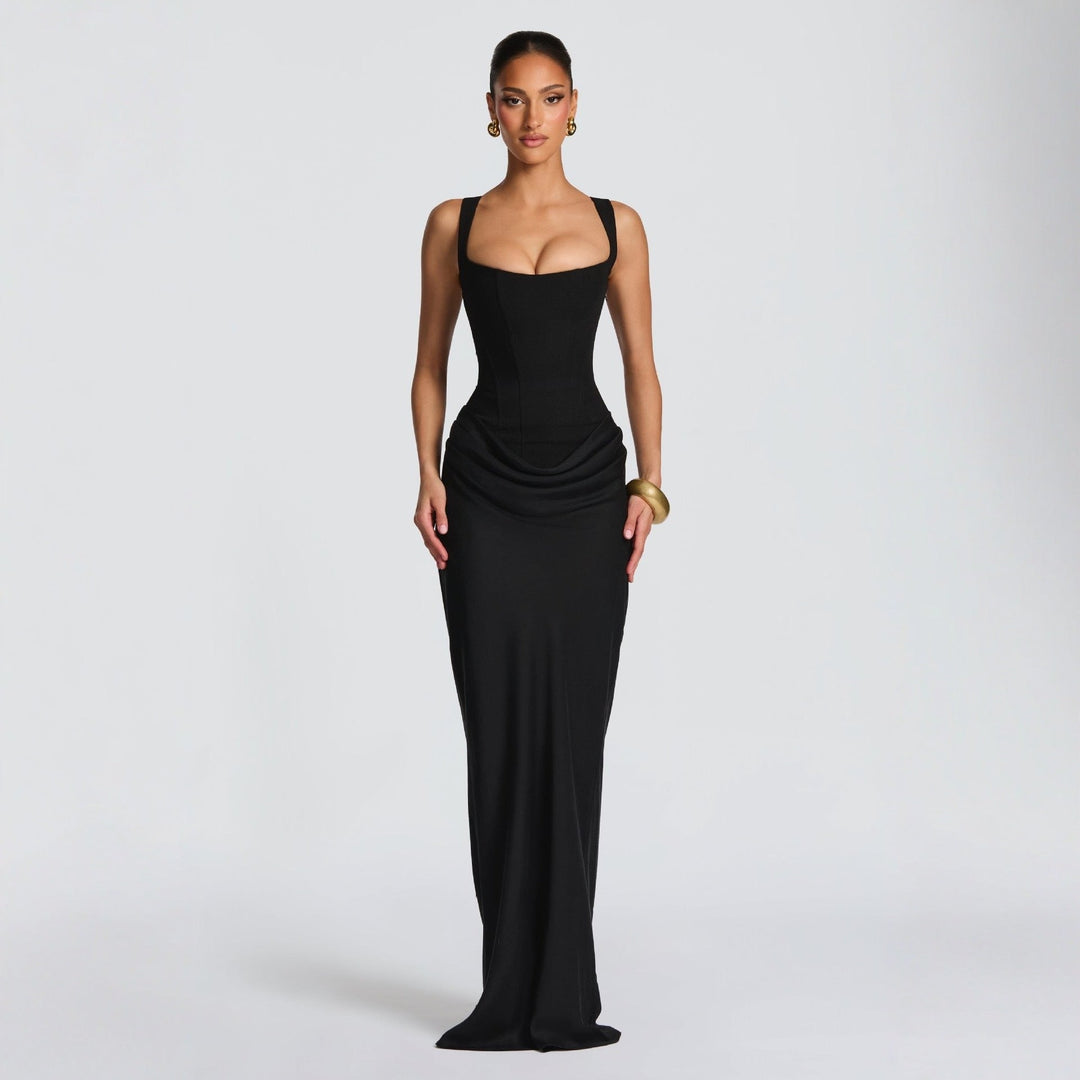 Women's sophisticated black maxi dress, fitted design, deep neckline, spaghetti straps. Perfect for special occasions.