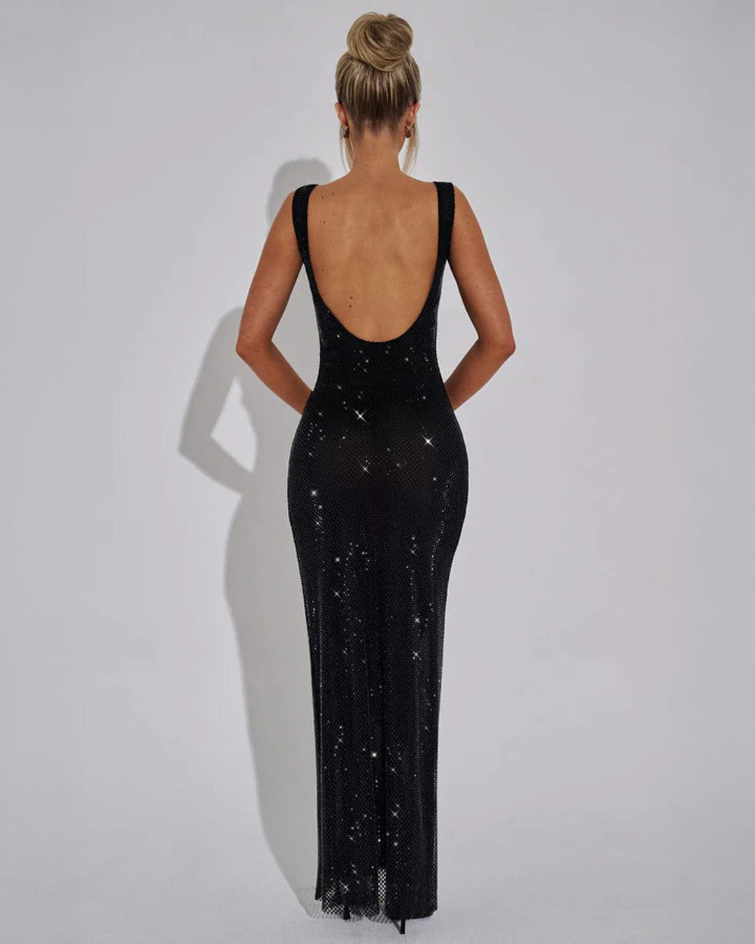 Elegant silver embellished evening dress, a luxurious choice for parties.
