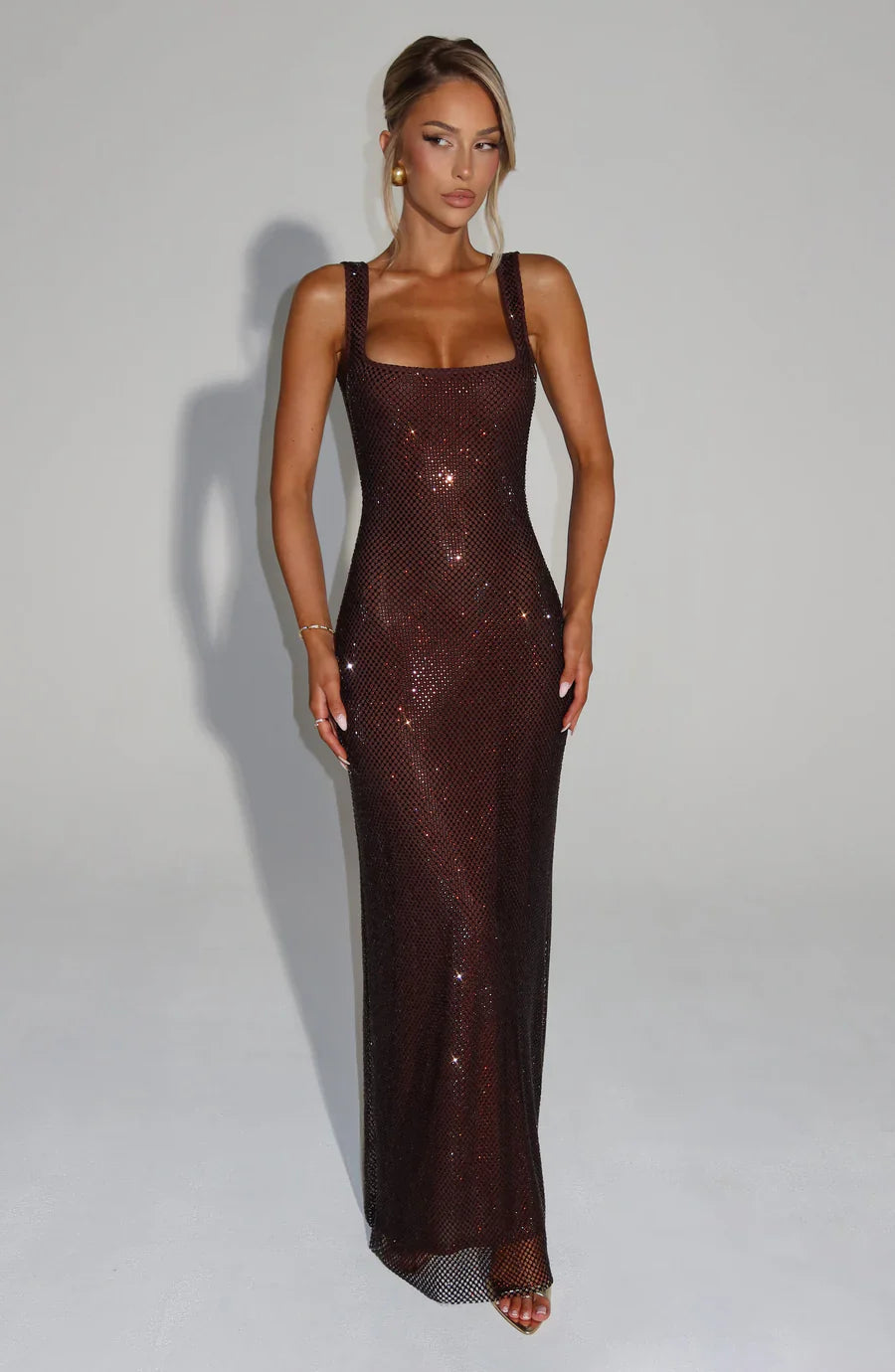 Stunning black embellished evening dress, a luxurious choice for parties.