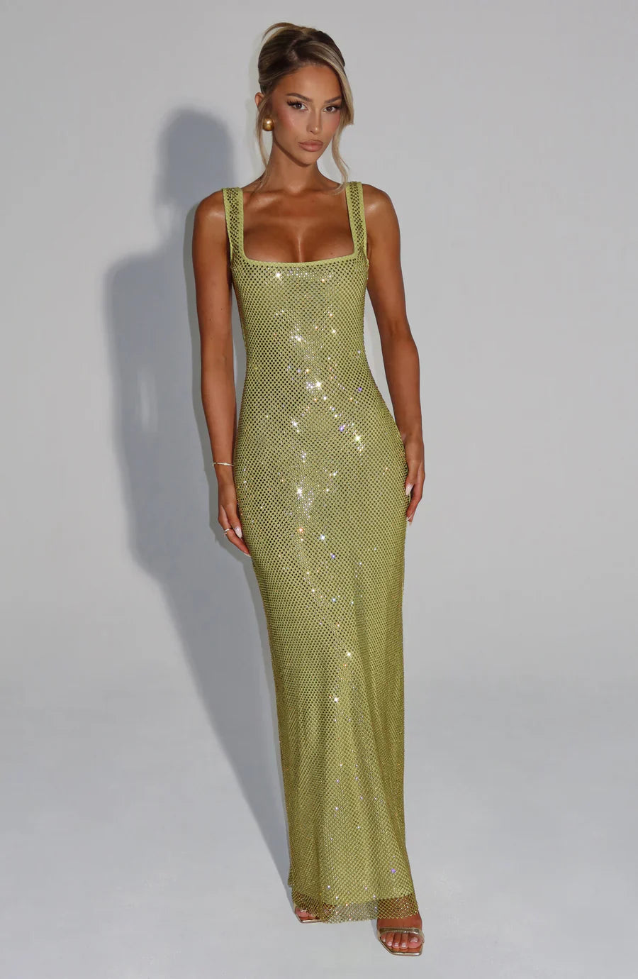 Back view: Elegant floor-length maxi dress with square neck and embellishments.
