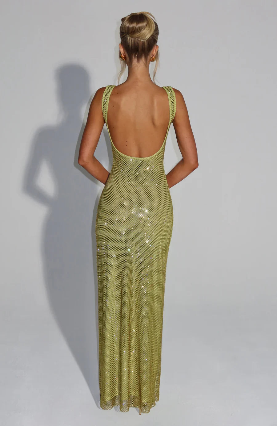 Side view: Graceful women's embellished maxi dress for formal events.