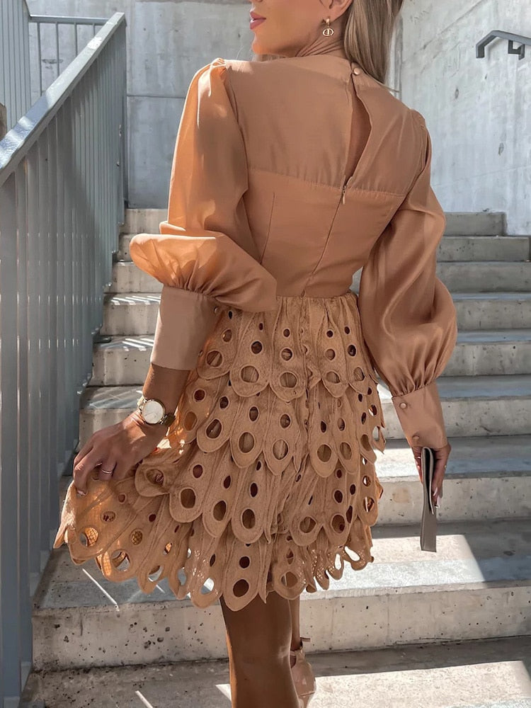 Versatile women's embroidered mini dress, perfect for beach or party, with sheer sleeves & cutwork.