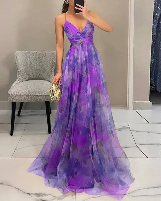Women's vibrant floral maxi dress, v-neck, backless, flowy, perfect for elegant summer holidays.