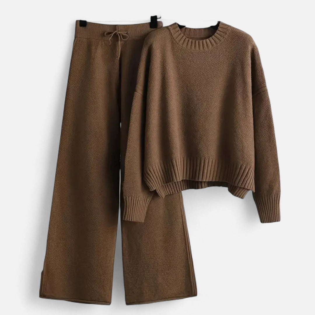 Elegant women's knit long sleeve sweater paired with matching wide-leg trousers, a chic two-piece set.